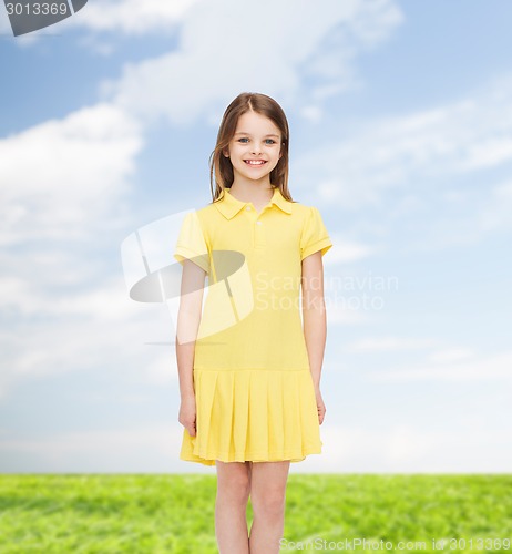 Image of smiling little girl in yellow dress