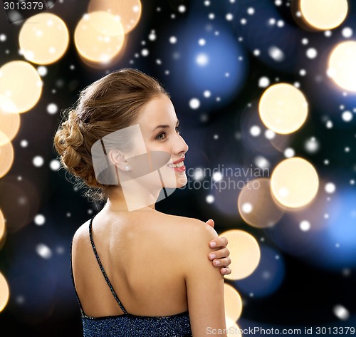 Image of smiling woman in evening dress