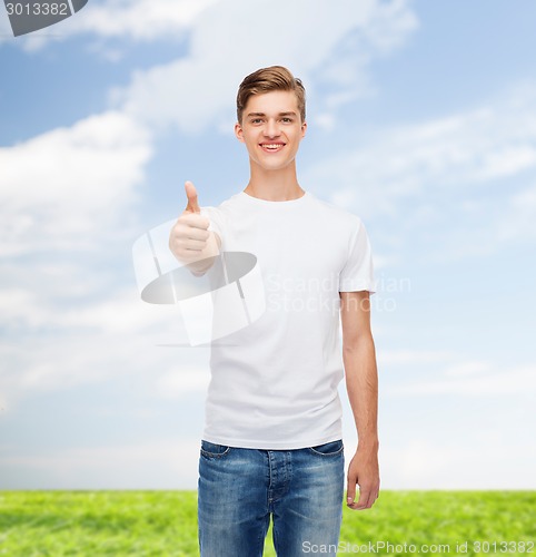 Image of smiling man in white t-shirt showing thumbs up