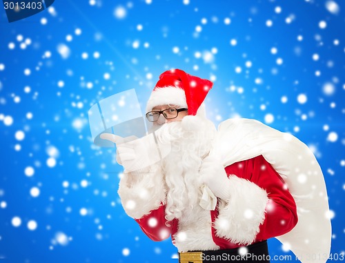 Image of man in costume of santa claus with bag
