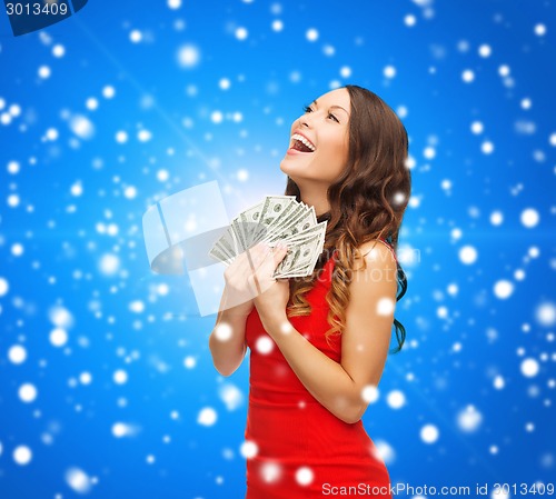 Image of woman in red dress with us dollar money