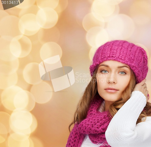 Image of smiling young woman in winter clothes