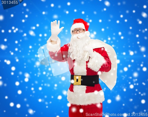 Image of man in costume of santa claus with bag