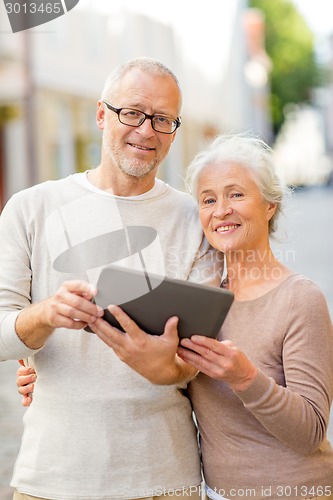 Image of senior couple photographing on city street