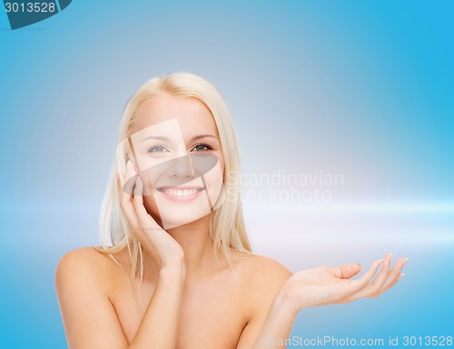 Image of smiling woman holding imaginary lotion jar