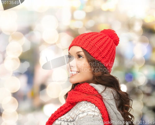 Image of smiling young woman in winter clothes