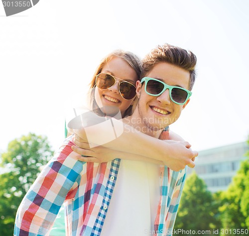 Image of smiling couple having fun in park