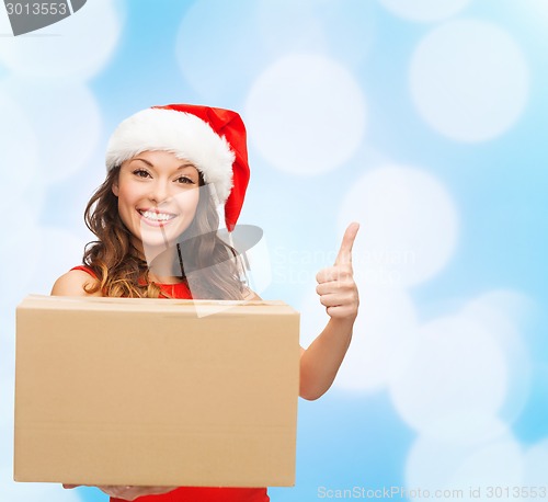 Image of smiling woman in santa helper hat with parcel box