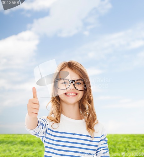 Image of little girl with black eyeglasses