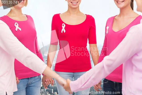 Image of close up of women with cancer awareness ribbons