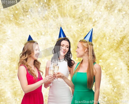 Image of smiling women holding glasses of sparkling wine