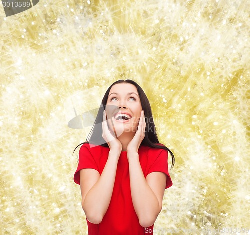 Image of smiling woman in red dress