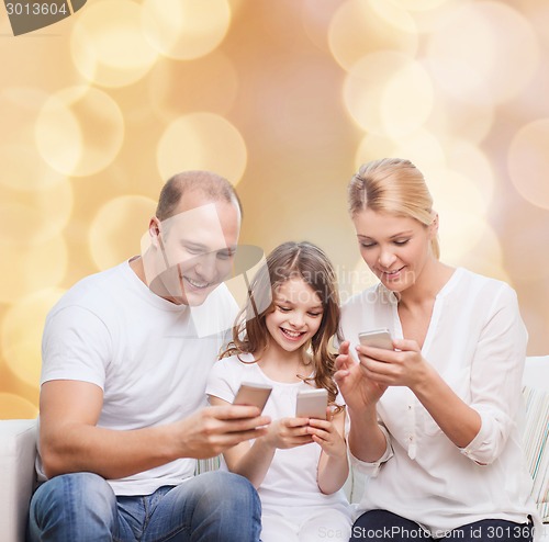 Image of happy family with smartphones