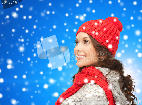 Image of smiling young woman in winter clothes