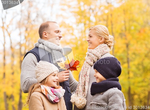 Image of happy family in autumn park