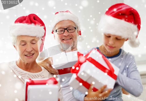 Image of happy family sitting on couch at home