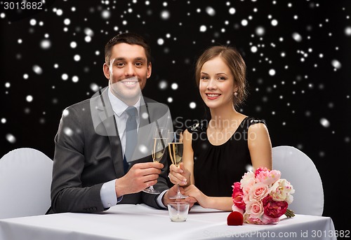 Image of smiling couple at restaurant