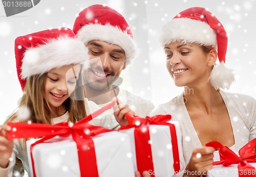 Image of happy family sitting on couch at home