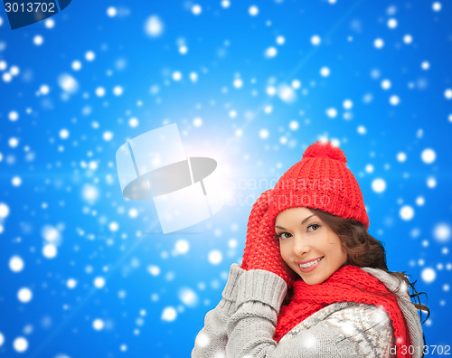 Image of smiling young woman in winter clothes