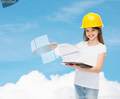 Image of smiling little girl in hardhat with clipboard