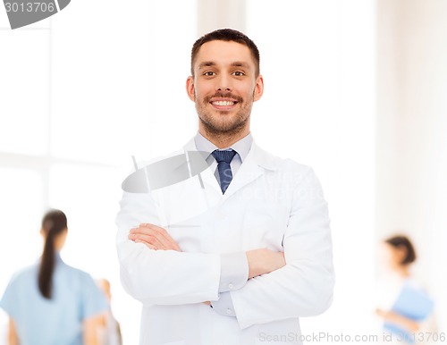 Image of smiling male doctor in white coat