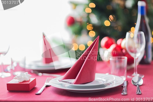 Image of room with christmas tree and decorated table