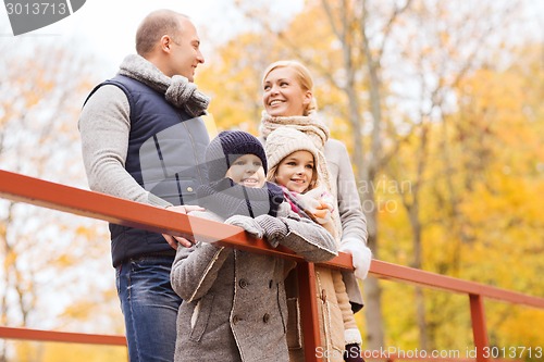 Image of happy family in autumn park