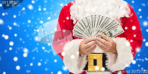 Image of close up of santa claus with dollar money