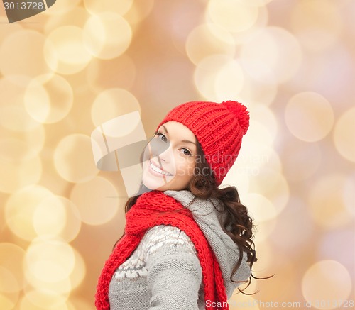 Image of smiling young woman in winter clothes