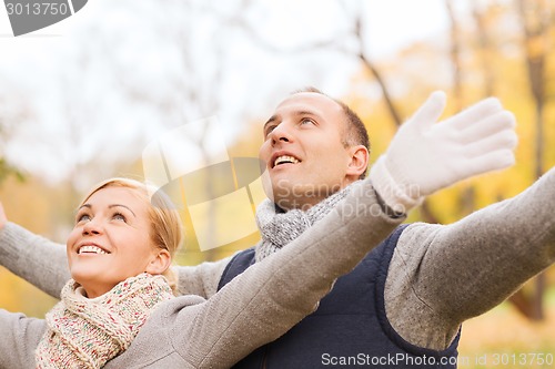 Image of smiling couple in autumn park