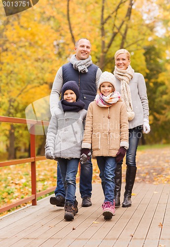 Image of happy family in autumn park
