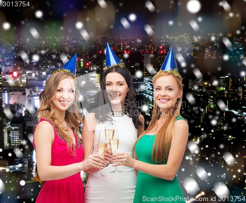 Image of smiling women holding glasses of sparkling wine