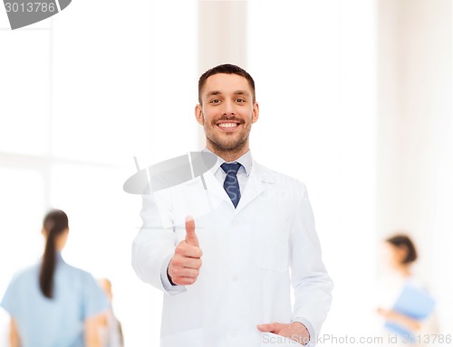 Image of smiling male doctor showing thumbs up