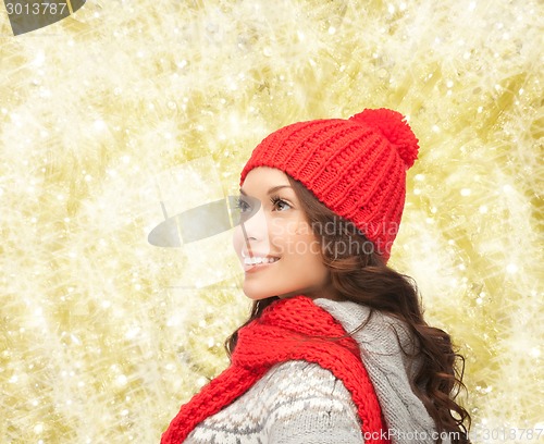 Image of smiling young woman in winter clothes