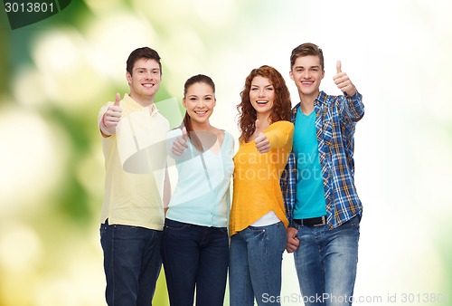 Image of group of smiling teenagers over green background