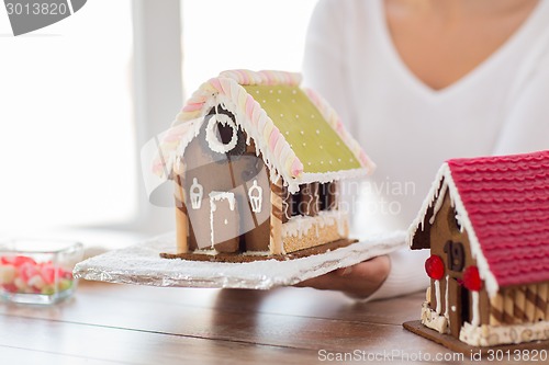 Image of close up of woman showing gingerbread house