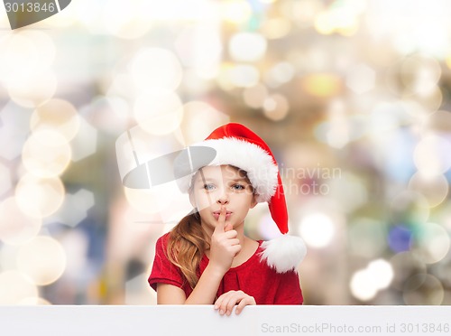 Image of smiling little girl in santa helper hat