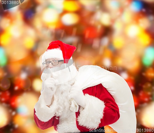 Image of man in costume of santa claus with bag