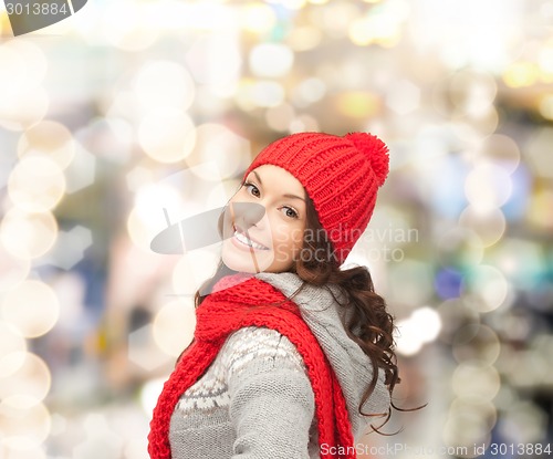 Image of smiling young woman in winter clothes