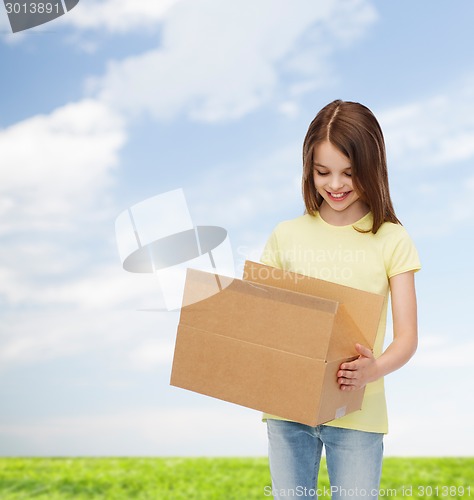 Image of smiling little girl in white blank t-shirt