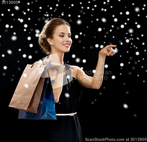 Image of smiling woman with shopping bags