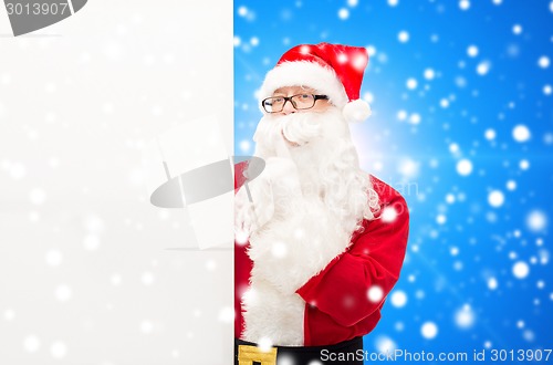 Image of man in costume of santa claus with billboard