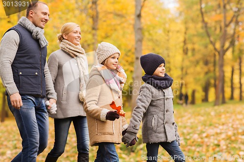 Image of happy family in autumn park