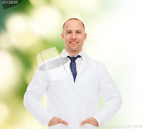 Image of smiling male doctor in white coat