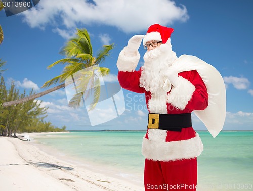 Image of man in costume of santa claus with bag