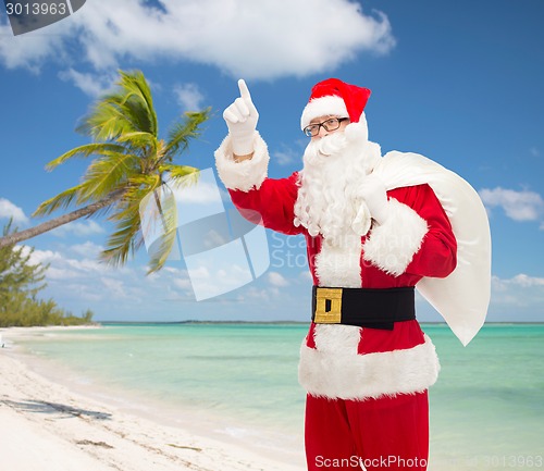 Image of man in costume of santa claus with bag