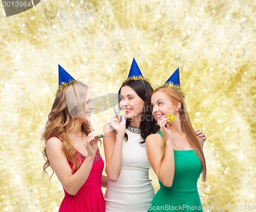 Image of smiling women holding glasses of sparkling wine