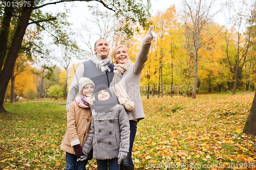 Image of happy family in autumn park