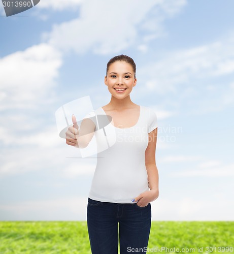 Image of smiling young woman in blank white t-shirt