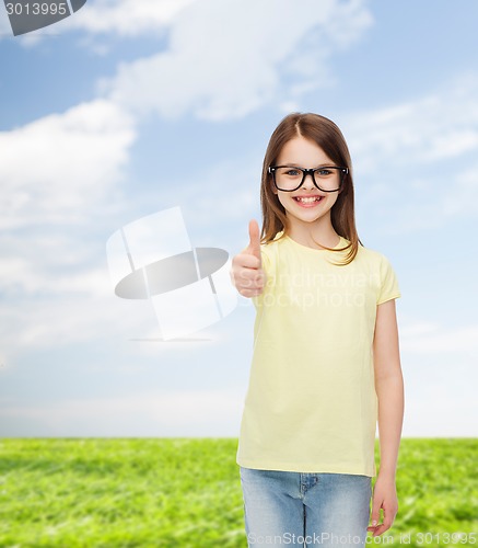 Image of smiling cute little girl in black eyeglasses